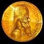 Символ Scatter в виде золотой монеты с лицом старца в Silk Road